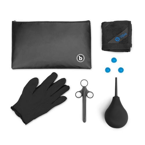 enema bulb, lube shooter, finger condoms, gloves, towel and storage bag