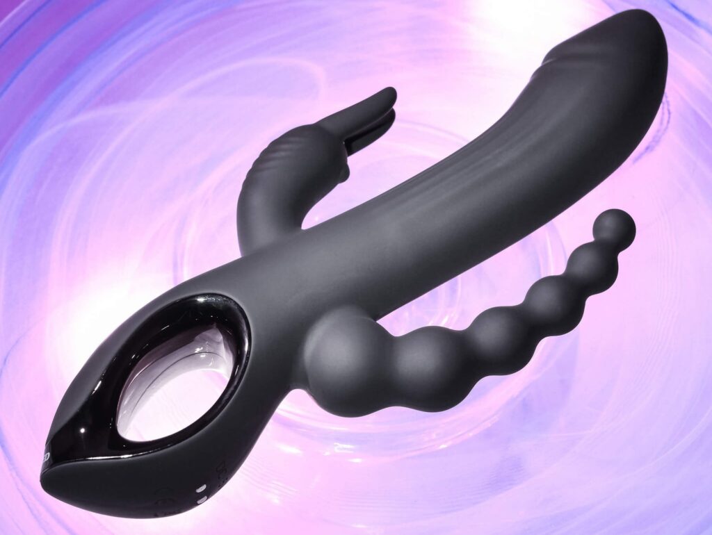 The Evolved Trifecta in front of a bright, colorful purple background. The purple swirls behind the vibrator. | Kinkly Shop